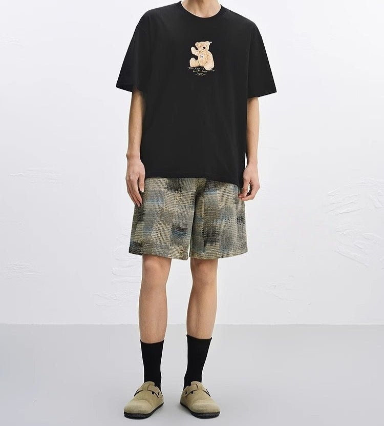 Black T-Shirt featuring an Embroidered Bear T-Shirt design with a playful bear graphic on the front