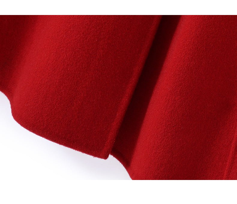 Detail of the Extra-Long Double Wool Coat With Detachable Shawl Collar in vibrant red fabric