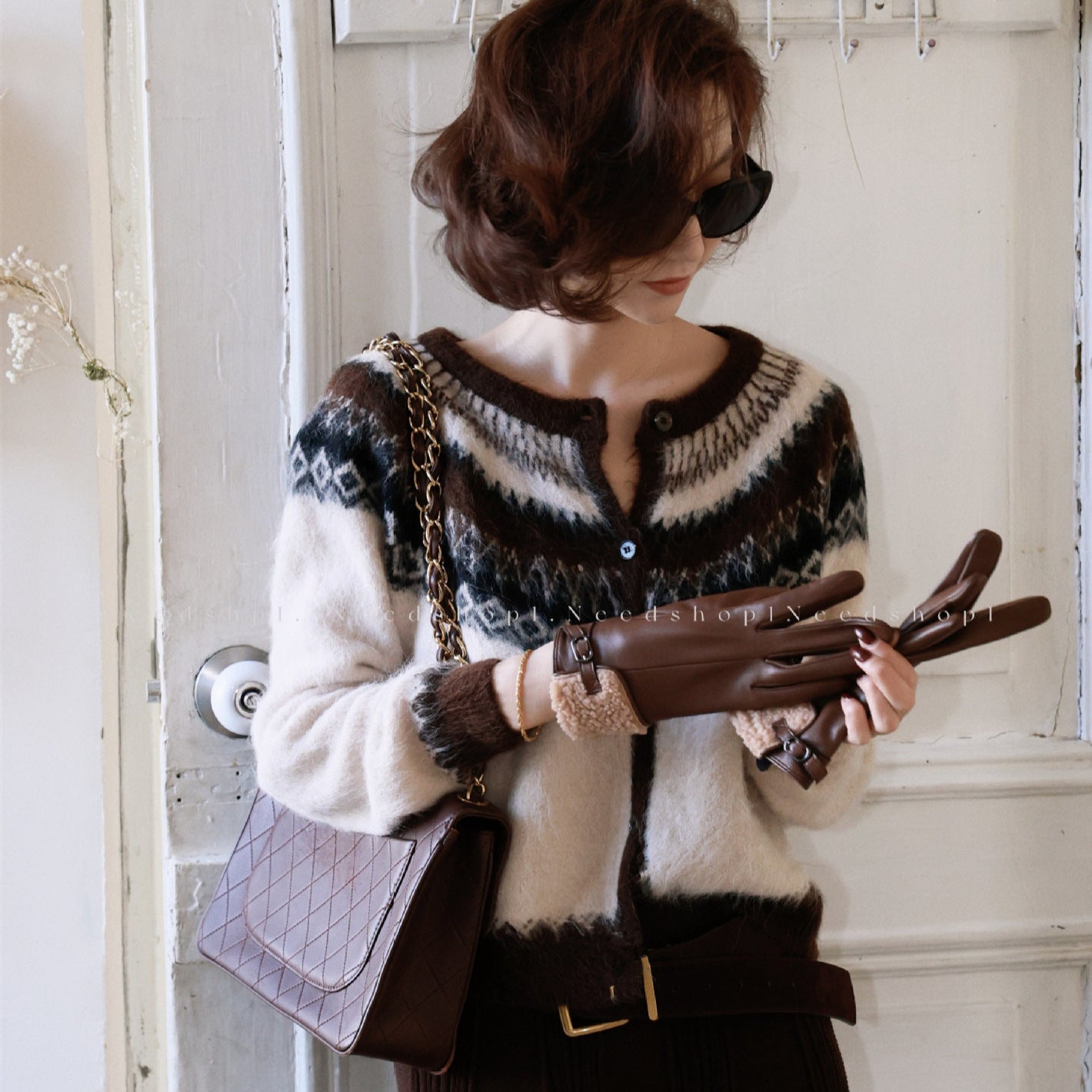 Women's Fair Isle Core Cardigan with a cozy design and button closure, styled with stylish accessories