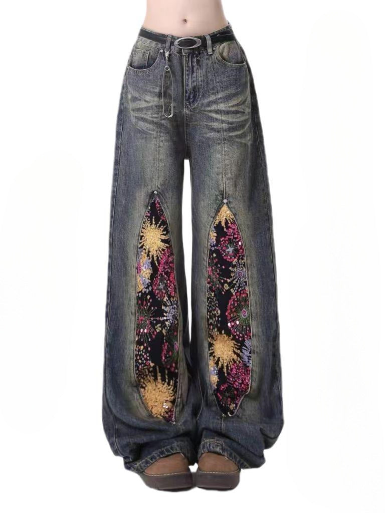 Firework Bloom Wide-Leg Denim Pants with colorful floral patterns on a vintage wash base