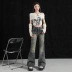 Stylish model wearing AM Vision RO flared pants with retro air and artistic wear, paired with a crop top