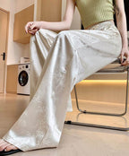 Elegant Floral Glow Pants in silky fabric, perfect for stylish daytime or evening outfits
