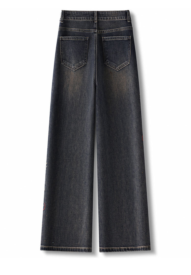 Back view of Floral Rhinestone Vintage Jeans with wide legs and decorative detailing