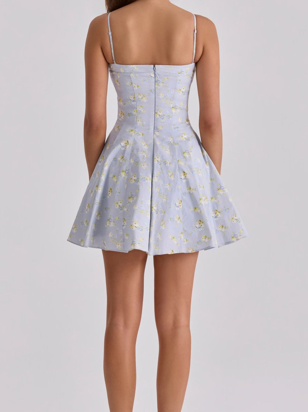 Back view of a French Floral Mini Slip Dress with thin straps and a flared skirt