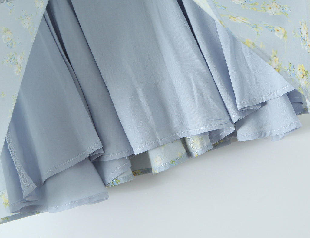 French Floral Mini Slip Dress with delicate floral patterns and a light blue fabric, perfect for warm weather outings