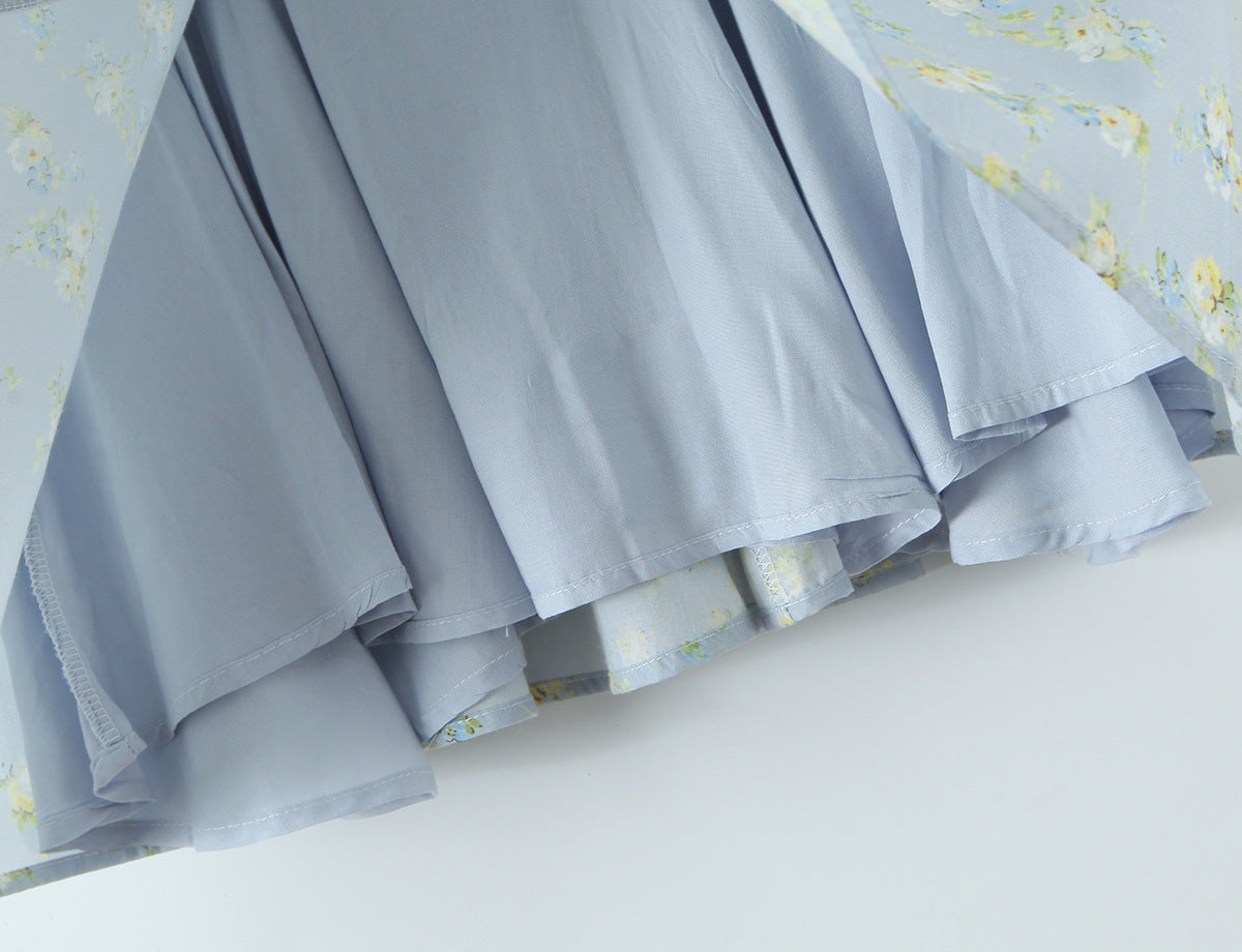 French Floral Mini Slip Dress with delicate floral patterns and a light blue fabric, perfect for warm weather outings