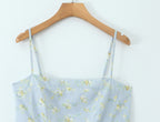 Delicate French Floral Mini Slip Dress with light blue fabric and floral pattern, ideal for warm weather