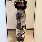Trendy outfit featuring Graffiti Heat Straight Denim pants with unique artistic designs and a stylish crop top