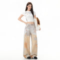 Trendy model wearing Graffiti Orange Jeans With 3D Print paired with a stylish white crop top