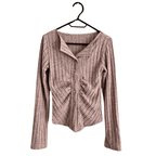 Grey knitted cardigan with a ribbed texture and button closure for a cozy look