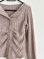 Stylish grey knitted cardigan with ribbed texture and button closure for a cozy look