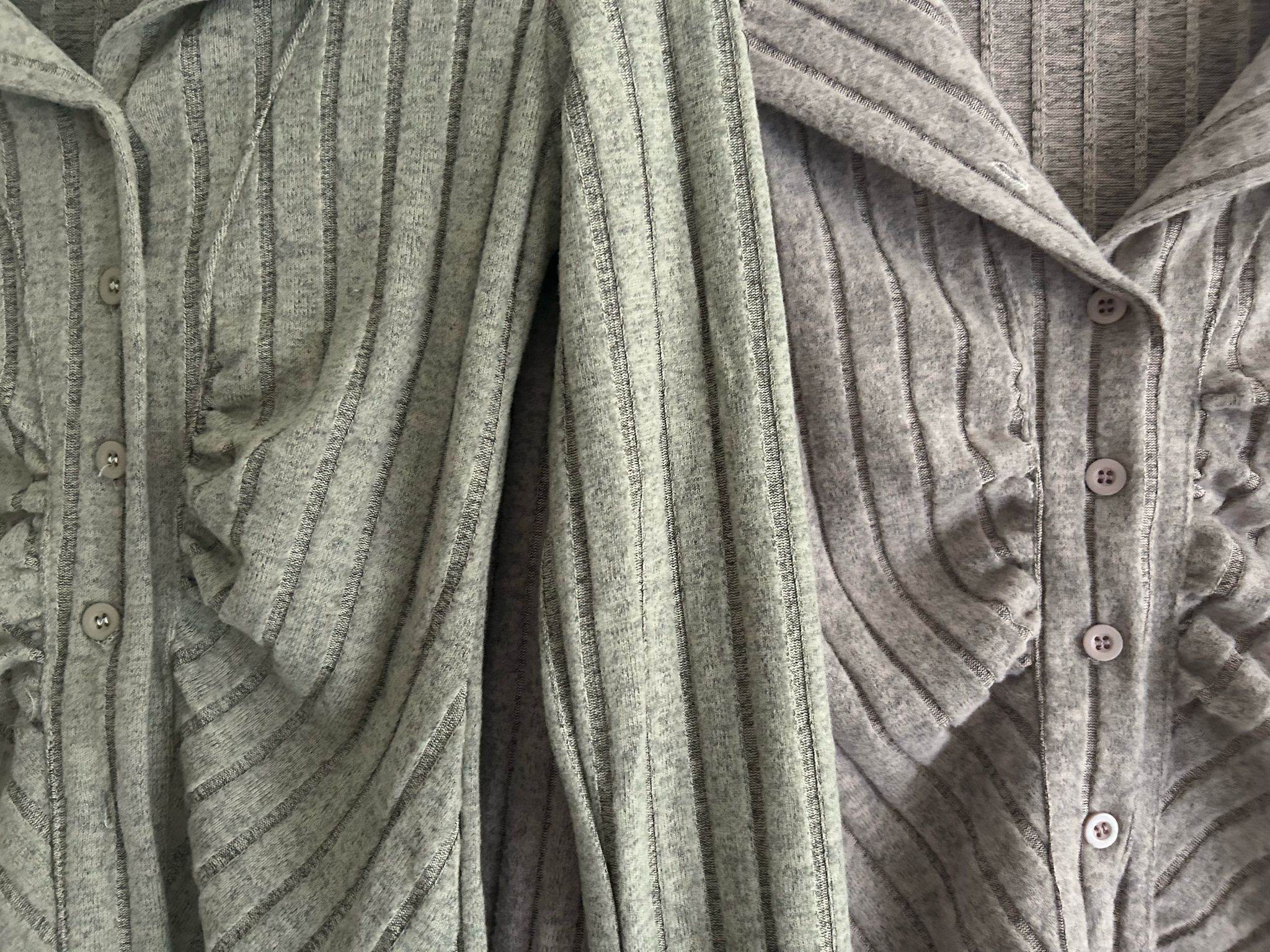 Two grey knitted cardigans with ribbed texture and button details for cozy layering