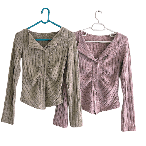 Two-tone grey knitted cardigan with ribbed texture and button closure, perfect for layering