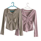 Two-tone grey knitted cardigan with ribbed texture and button closure, perfect for layering