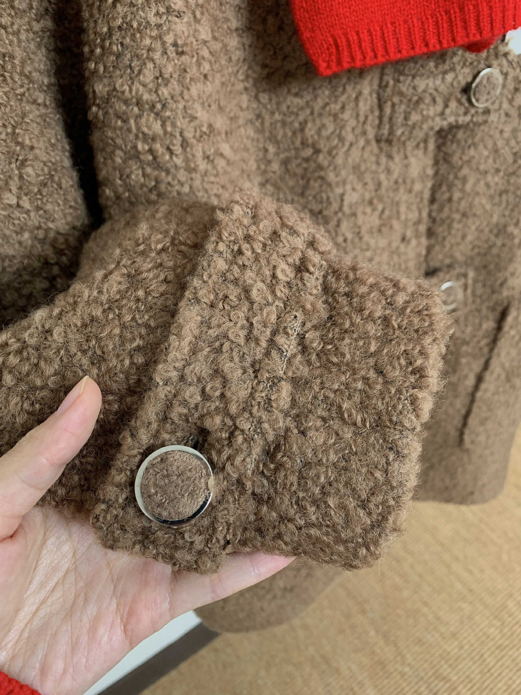 Close-up of High-End Loose Fit Wool Winter Coat showing textured fabric and button detail