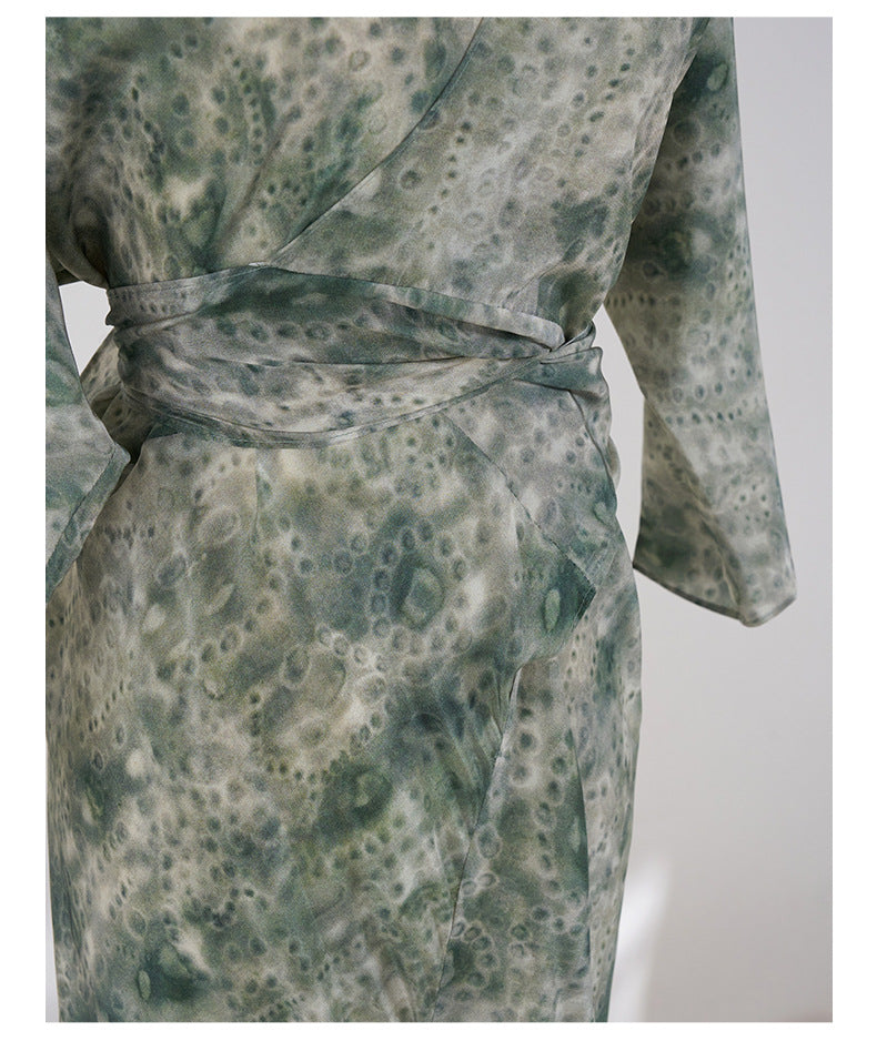 Jade Silk Wrap Dress featuring a unique green pattern and a stylish wrap design for elegant occasions