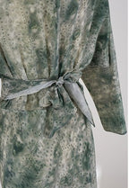 Jade Silk Wrap Dress featuring a belt and a soft textured fabric with a green pattern