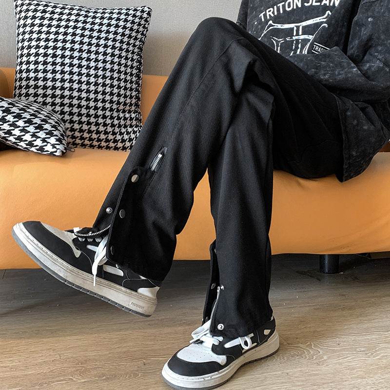 Stylish black jeans with leg studs featuring a relaxed fit, perfect for casual wear