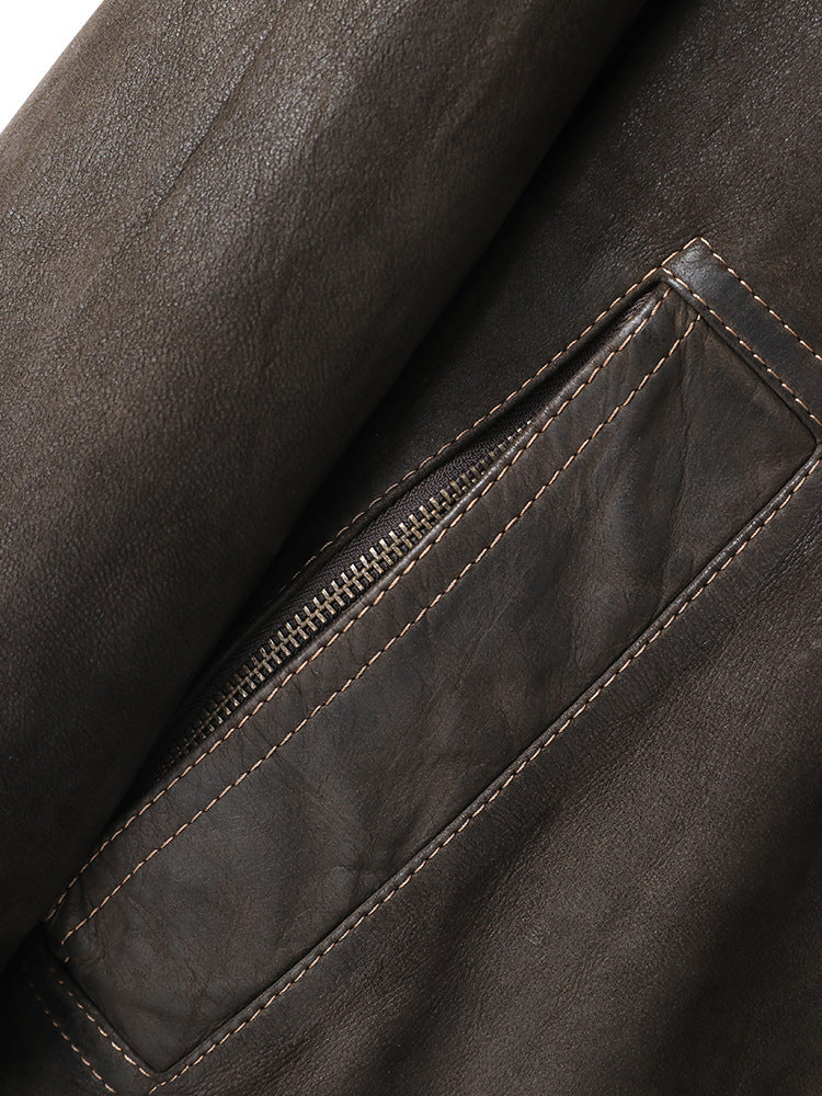 Close-up of the pocket detailing on the Kael Distressed Goatskin Leather Jacket in dark brown