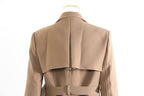 Back view of khaki trench coat for women featuring a stylish design and belt detail