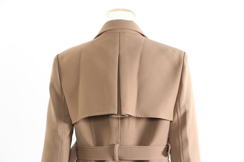 Back view of khaki trench coat for women featuring a stylish design and belt detail
