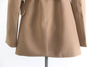 Back view of a stylish khaki trench coat for women with a tailored fit and belted waist