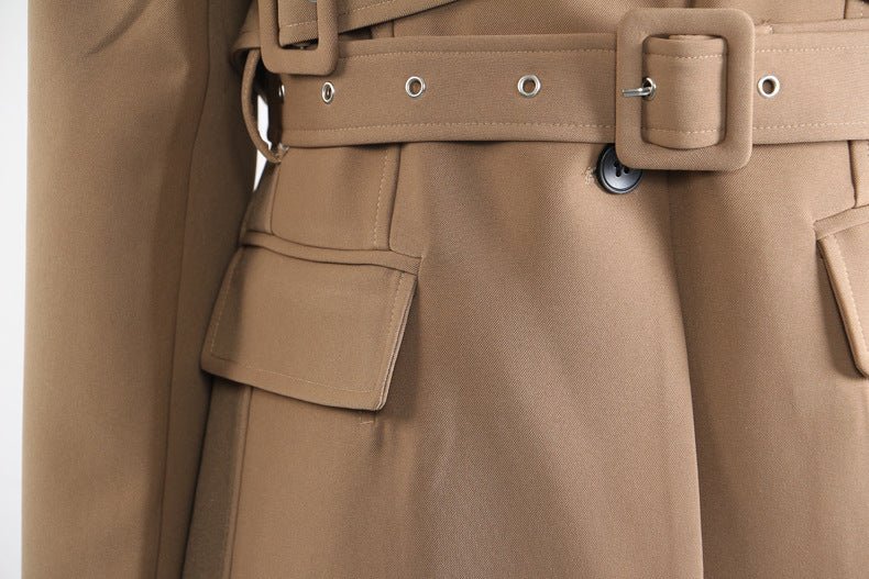 Close-up of a khaki trench coat for women featuring a belted waist and pocket details