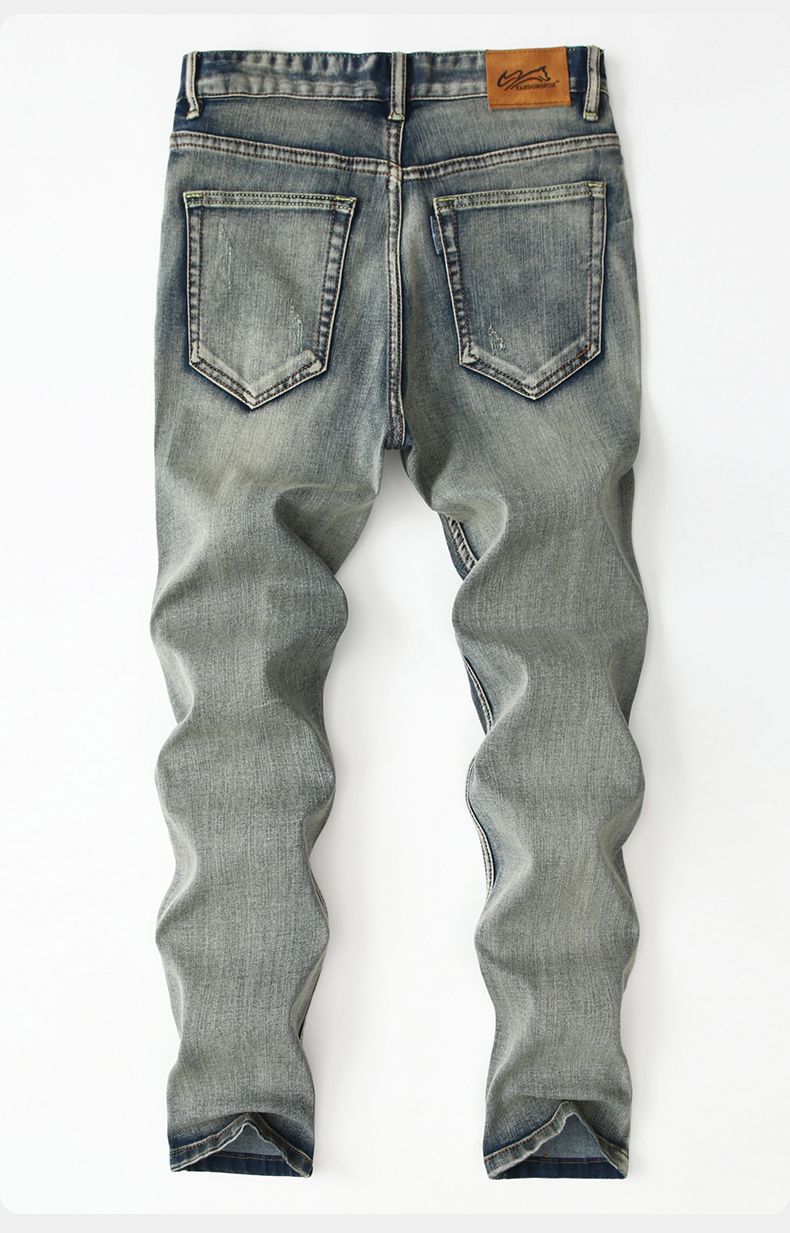 Koi Dynasty Embroidered Jeans in light wash with a slim fit and detailed stitching on the back pockets