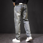 Men's Koi Dynasty Embroidered Jeans in faded blue with a relaxed fit and unique design details