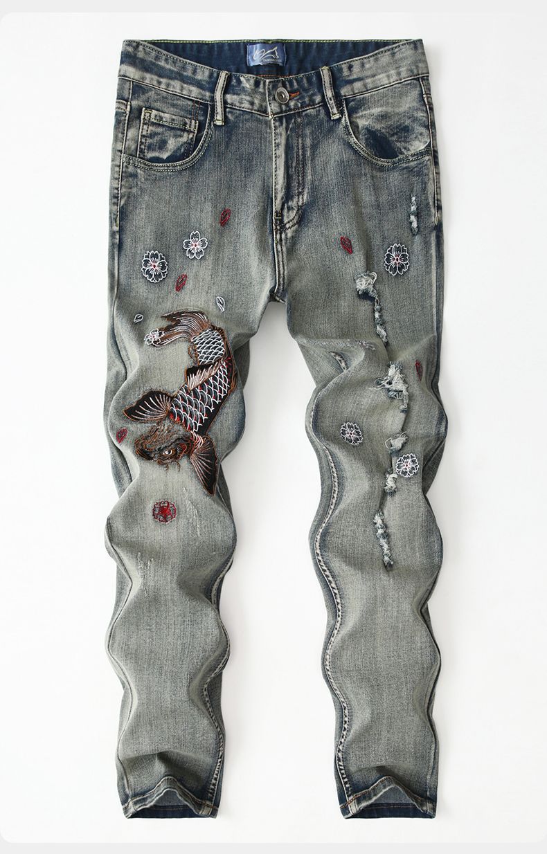 Koi Dynasty Embroidered Jeans featuring intricate koi fish and floral designs on faded denim