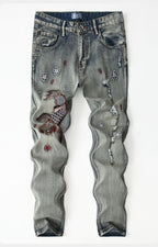 Koi Dynasty Embroidered Jeans featuring intricate koi fish and floral designs on faded denim