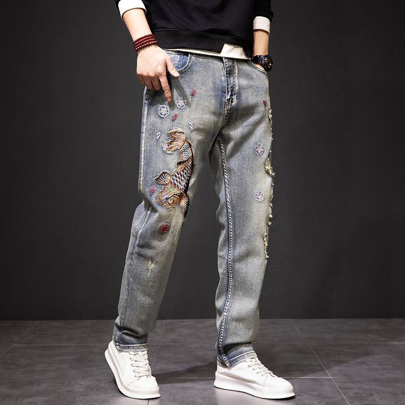 Koi Dynasty Embroidered Jeans featuring intricate designs and a relaxed fit for a stylish look