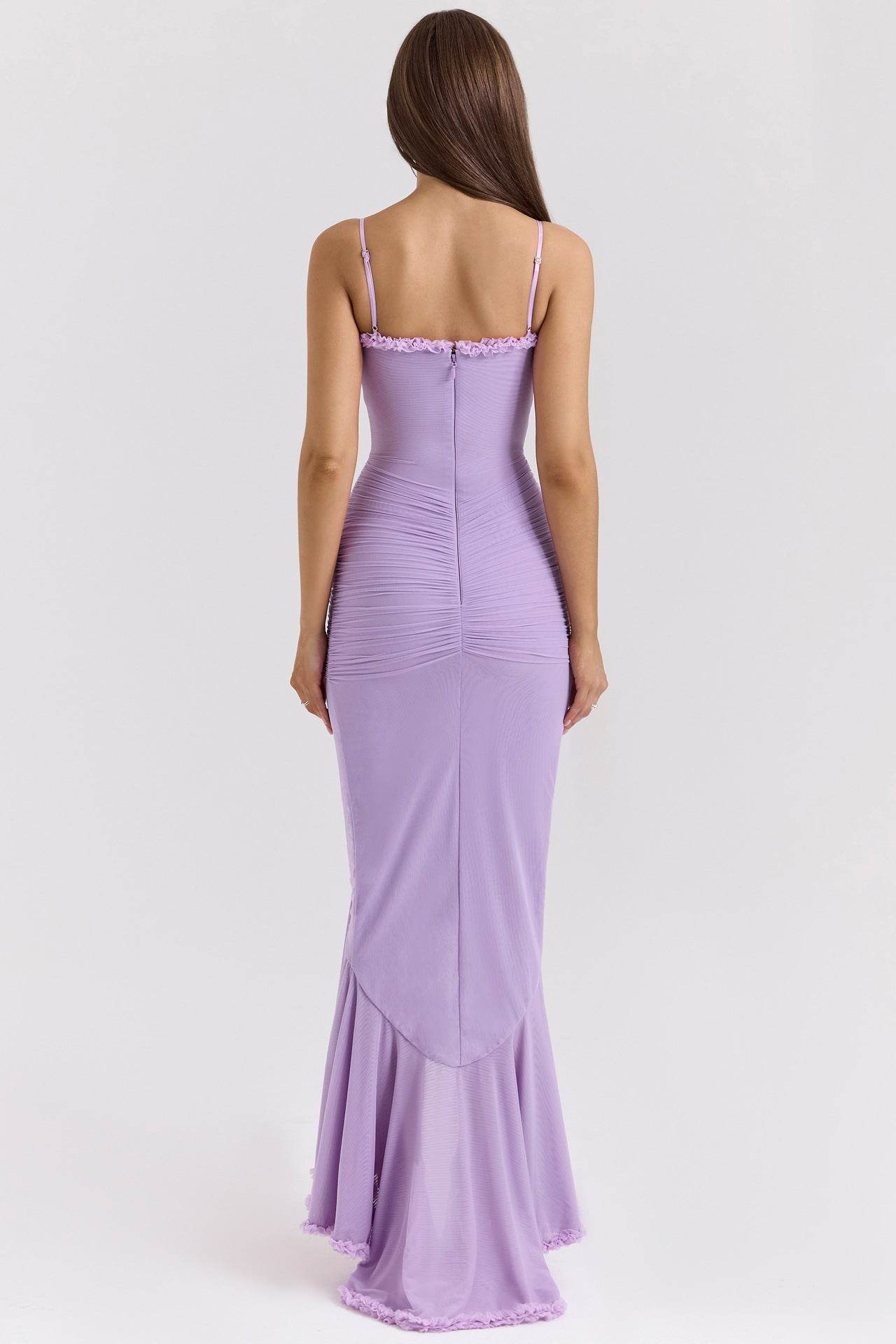 Back view of a Lace Charm Orchid Dress in lavender with a fitted silhouette and ruffled hemline