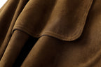 Close-up of the soft texture of the Leonora Suede Coat showcasing rich brown fabric details