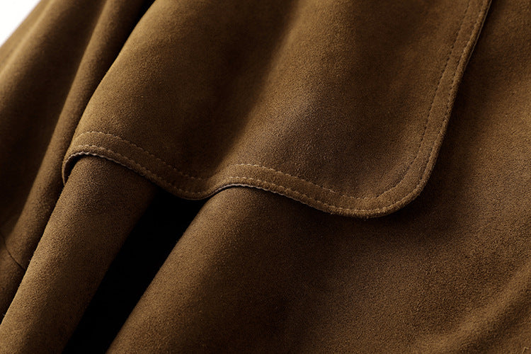 Close-up of the soft texture of the Leonora Suede Coat showcasing rich brown fabric details
