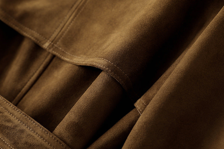 Close-up of the soft fabric texture of the Leonora Suede Coat in rich brown color