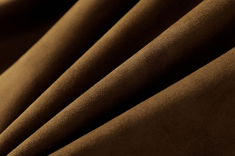 Close-up view of soft brown fabric showcasing the luxurious texture of the Leonora Suede Coat