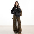 Trendy leopard print cargo pants styled with a black oversized sweatshirt and matching accessories
