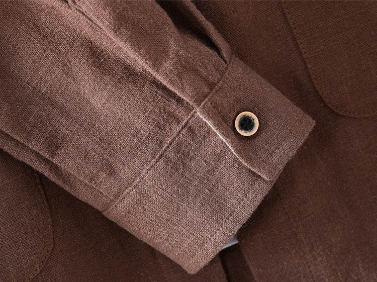 Close-up of AM Vision RO Linen Cardigan Shirt sleeve in a rich brown color featuring a button detail