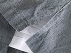 Close-up of a gray AM Vision RO Linen Cardigan Shirt showcasing the fabric texture and collar detail