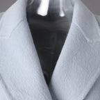 Close-up of a Long Baby Blue Wool Coat featuring a classic collar and soft texture