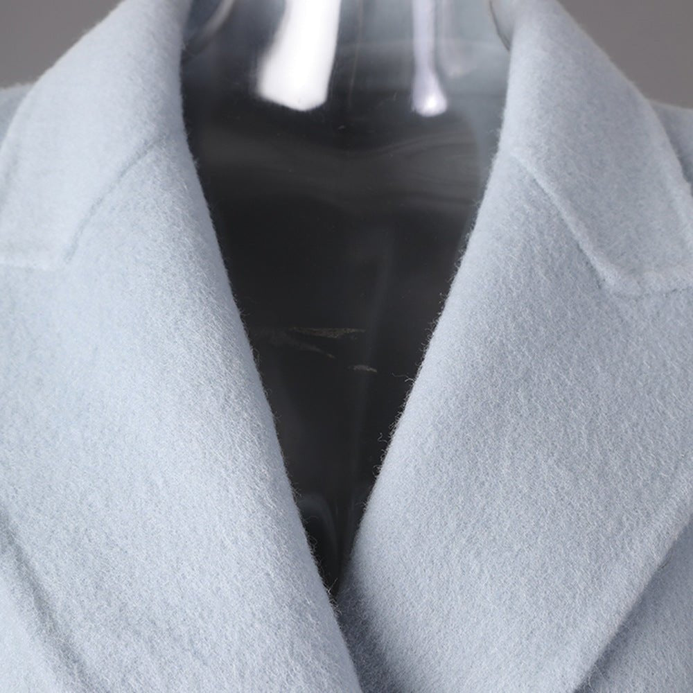 Close-up of a Long Baby Blue Wool Coat featuring a classic collar and soft texture