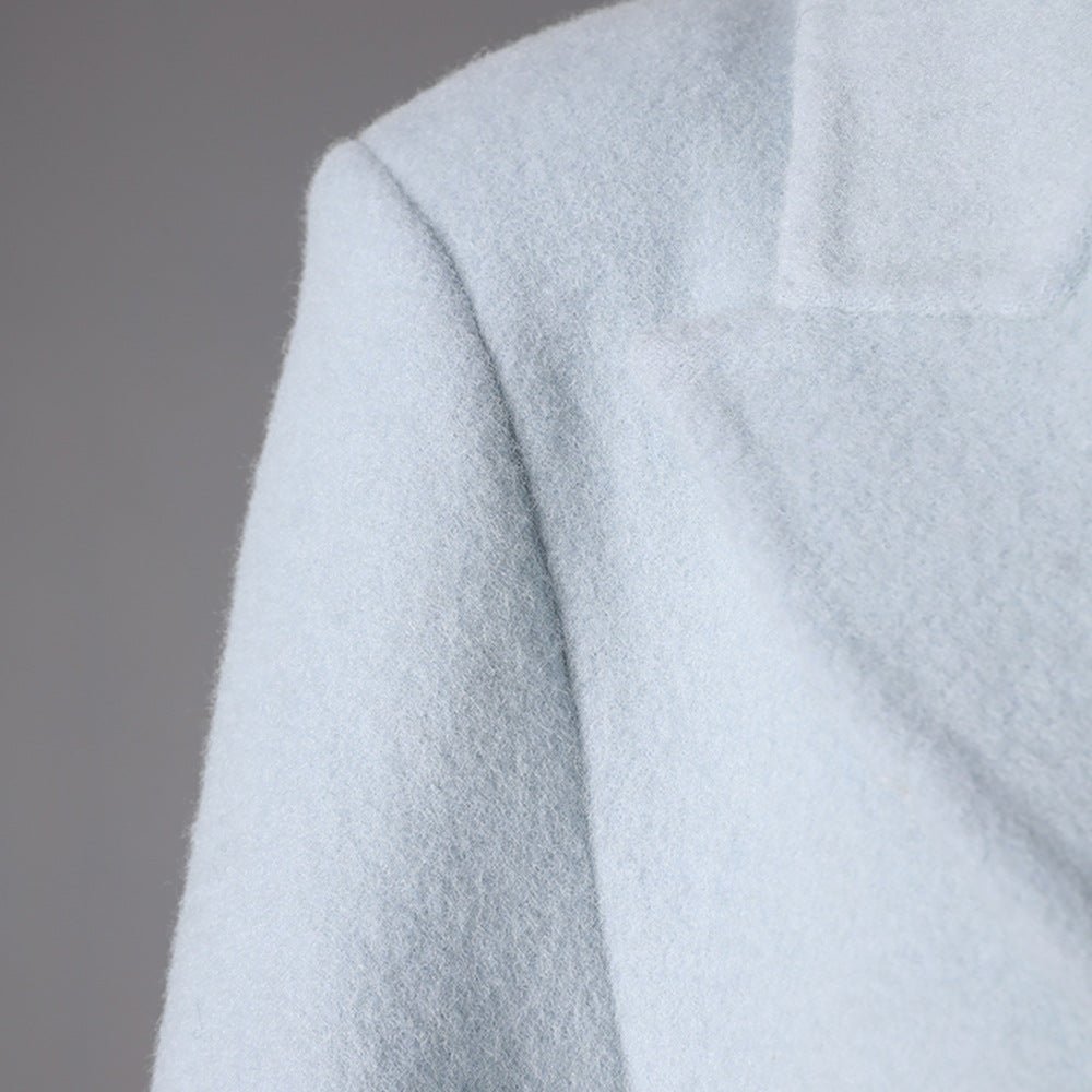 Detail of a Long Baby Blue Wool Coat featuring a classic collar and soft texture