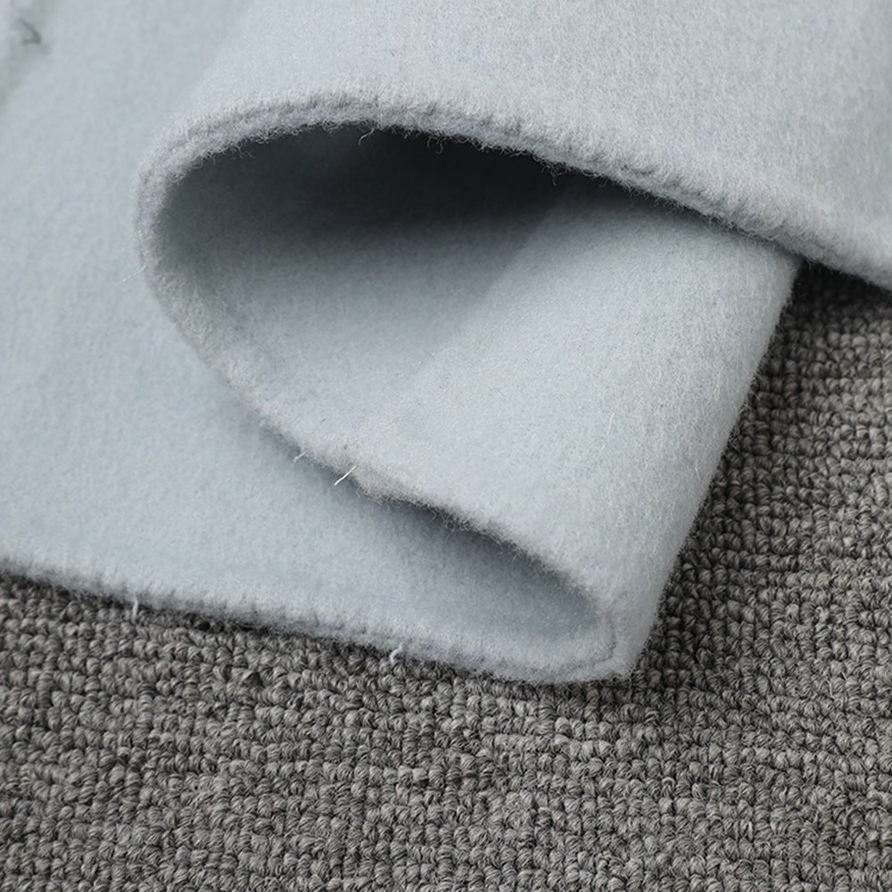 Close-up of the soft fabric of a Long Baby Blue Wool Coat from AM Vision RO