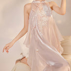 Elegant Long Dress with Embroidery featuring delicate floral designs and a flowing silhouette