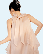 Back view of a stylish Long Dress with Embroidery featuring delicate sheer fabric and a bow detail