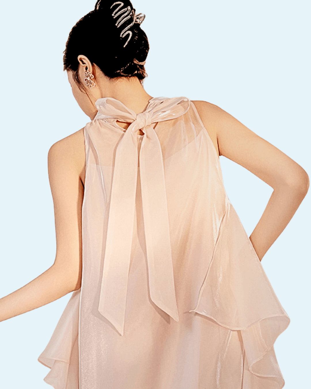 Back view of a stylish Long Dress with Embroidery featuring delicate sheer fabric and a bow detail