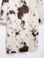 Long Faux Fur Effect Coat in white with brown spots, perfect for stylish winter layering