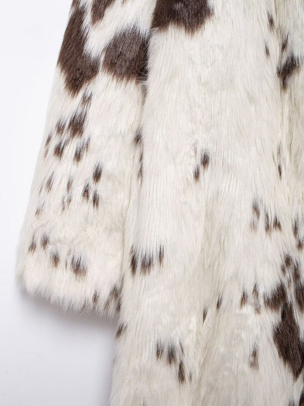 Long Faux Fur Effect Coat in white and brown pattern with soft textured fabric