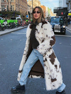 Trendy Long Faux Fur Effect Coat in spotted design, perfect for stylish winter outfits